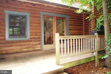 10677 River Road Rixeyville, VA 22737 - Photo 26 of 26 a view of a house with a small yard and wooden floor and fence