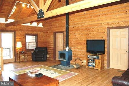10677 River Road Rixeyville, VA 22737 - Photo 6 of 26 a living room with fireplace furniture and a flat screen tv
