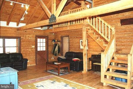 10677 River Road Rixeyville, VA 22737 - Photo 7 of 26 a living room with furniture and a rug