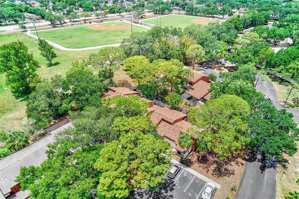 2064 Sunset Point Road, Unit 73 Clearwater, FL 33765 - Photo 49 of 58 an aerial view of residential house with outdoor space and swimming pool