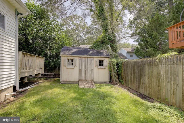 a view of a house with a yard and garage