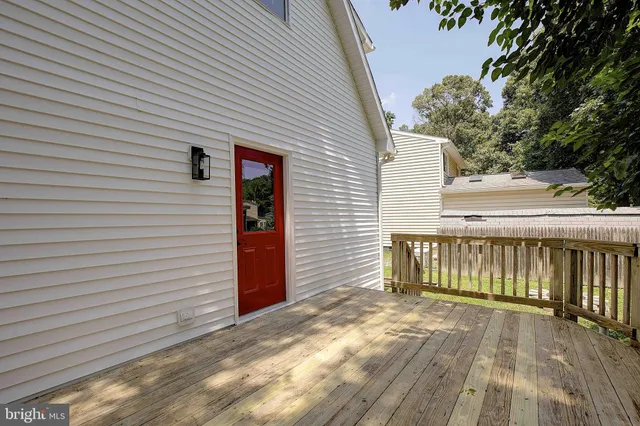 a view of backyard with a deck