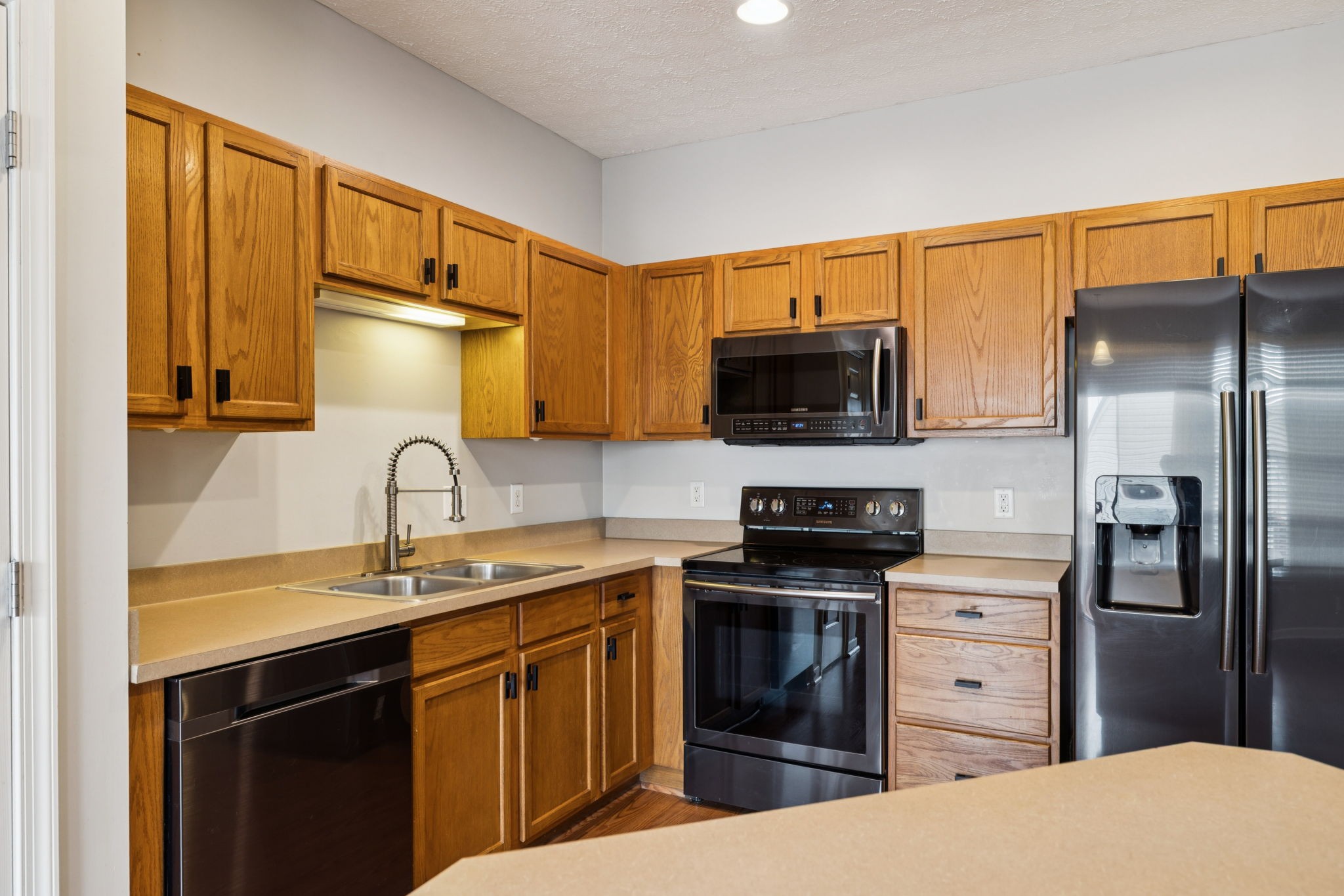 1345 Bell Road, Unit 412 Antioch, TN 37013 - Photo 12 of 34 a kitchen with stainless steel appliances a stove sink and refrigerator