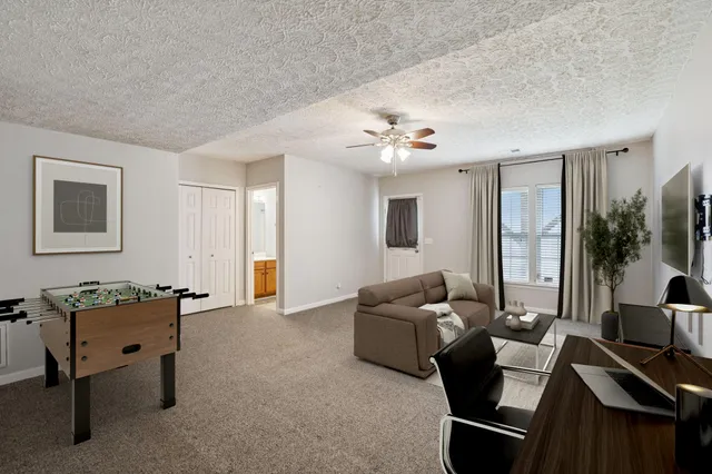 a living room with furniture and a table