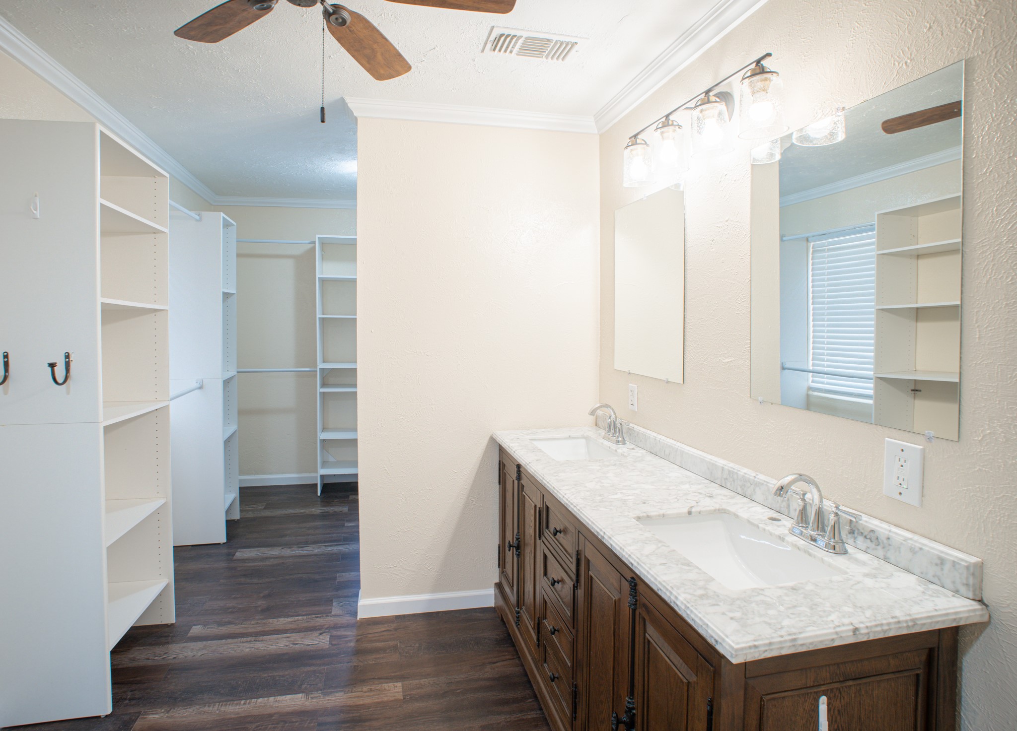 214 North Calhoun Street Groesbeck, TX 76642 - Photo 17 of 20 a bathroom with a granite countertop sink shower and a mirror