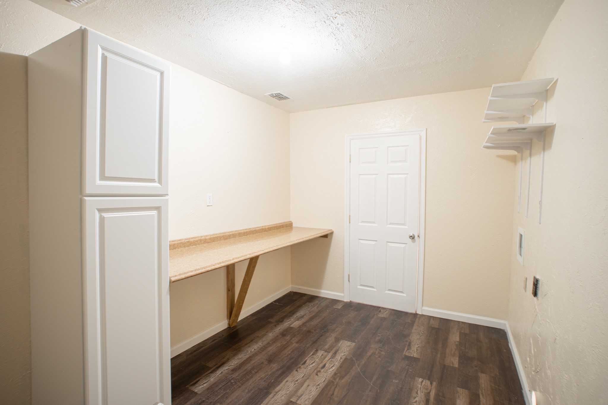 214 North Calhoun Street Groesbeck, TX 76642 - Photo 18 of 20 a room with storage and utility