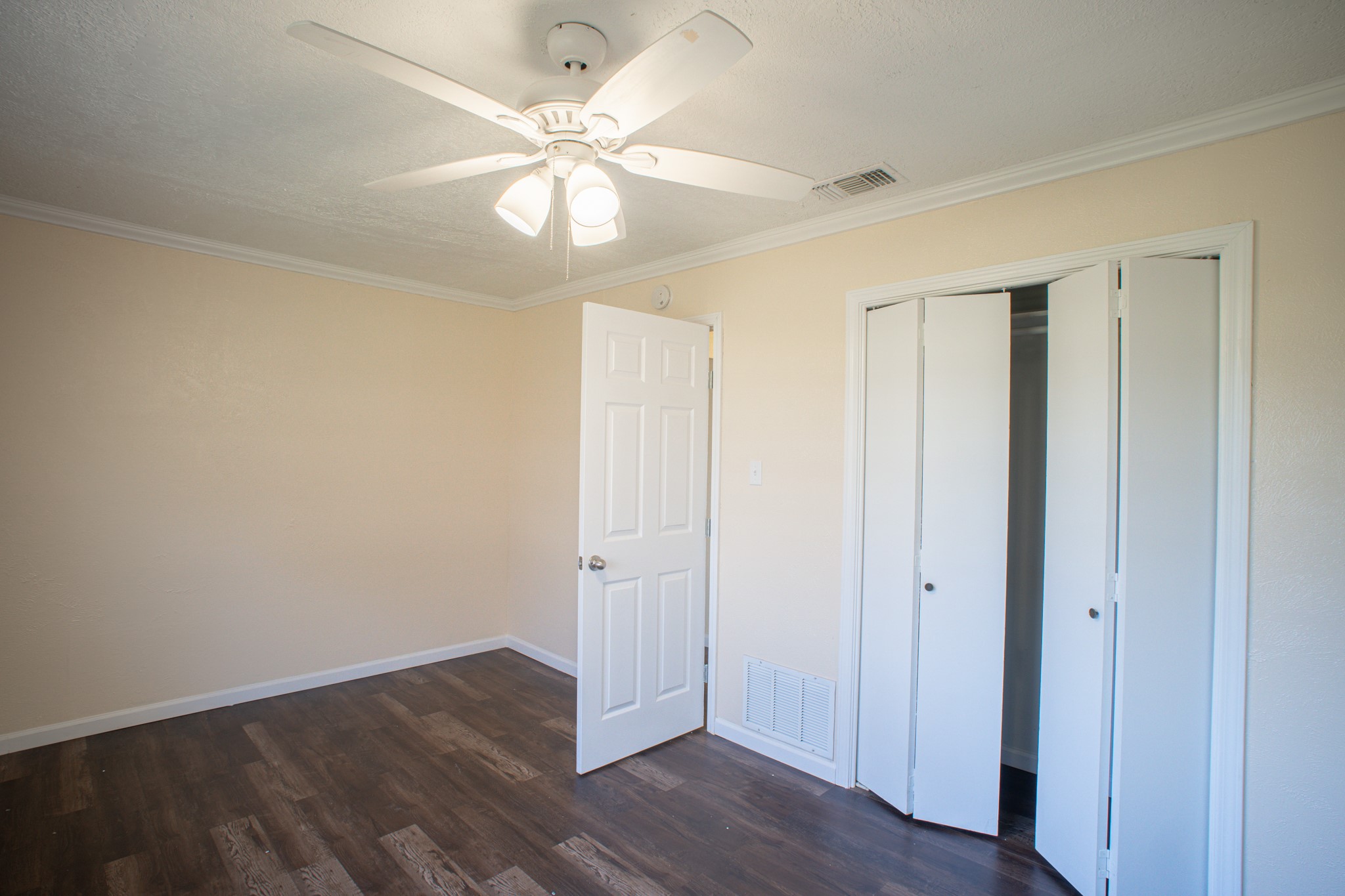 214 North Calhoun Street Groesbeck, TX 76642 - Photo 19 of 20 a view of an empty room with wooden floor