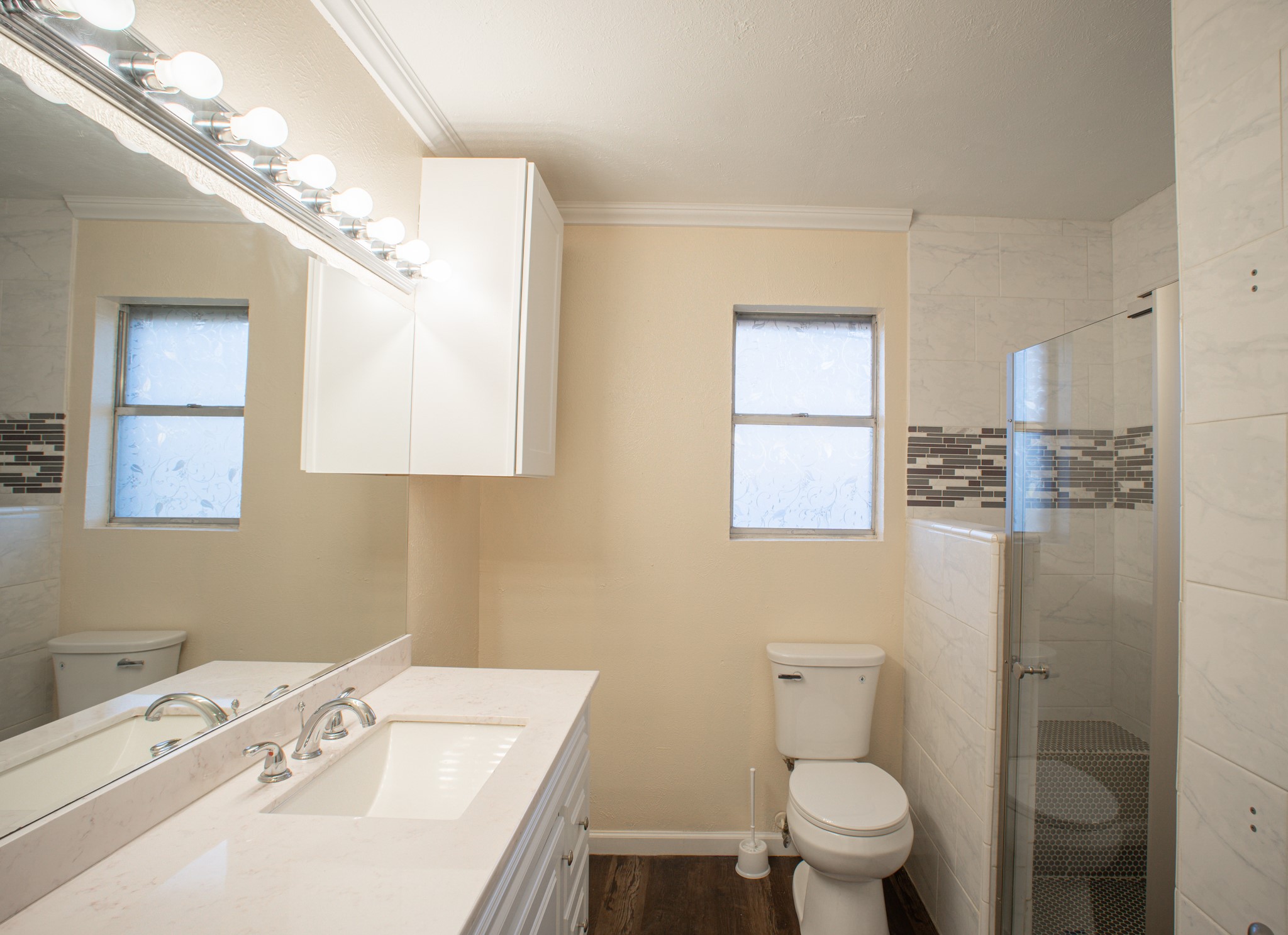 214 North Calhoun Street Groesbeck, TX 76642 - Photo 20 of 20 a bathroom with a sink a toilet and a mirror