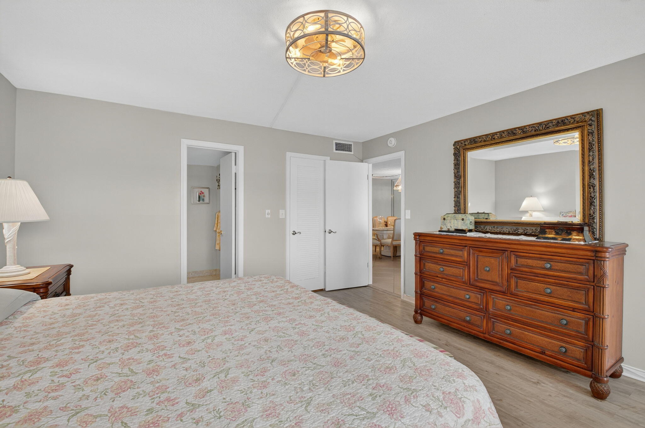 2871 North Ocean Boulevard, Unit R254 Boca Raton, FL 33431 - Photo 27 of 67 a bedroom with a bed and a dresser in it