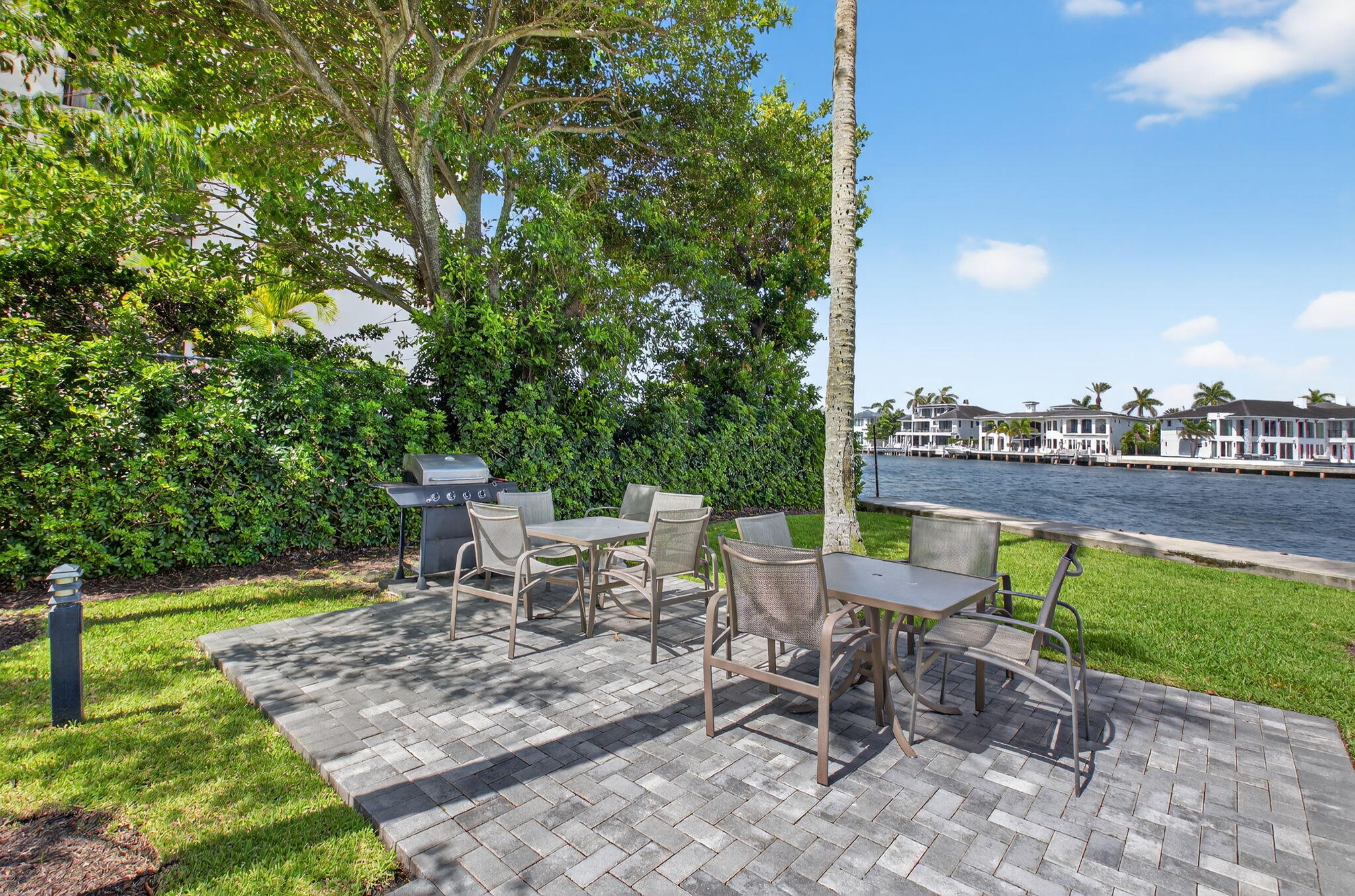 2871 North Ocean Boulevard, Unit R254 Boca Raton, FL 33431 - Photo 34 of 67 a view of a patio with a table and chairs