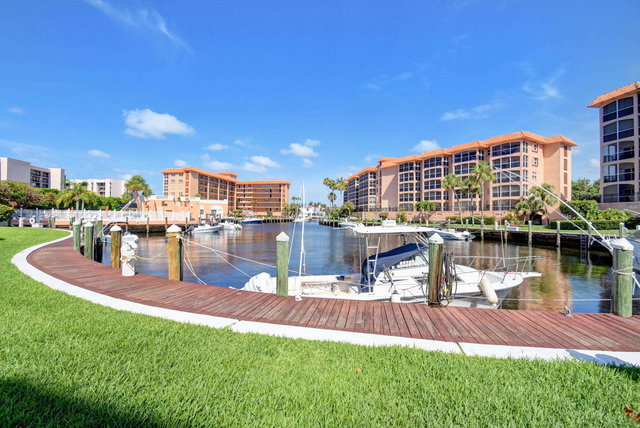 2871 North Ocean Boulevard, Unit R254 Boca Raton, FL 33431 - Photo 52 of 67 a view of a lake with a building and a big yard