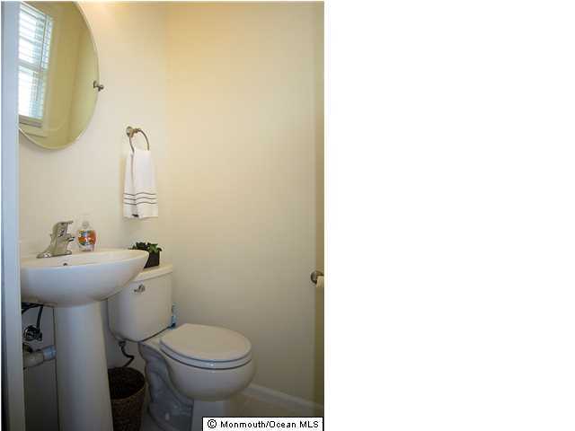 3305 Seaview Road Lavallette, NJ 08735 - Photo 11 of 13 a bathroom with a toilet sink and mirror