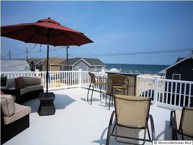 3305 Seaview Road Lavallette, NJ 08735 - Photo 3 of 13 a view of a chairs and table in the patio