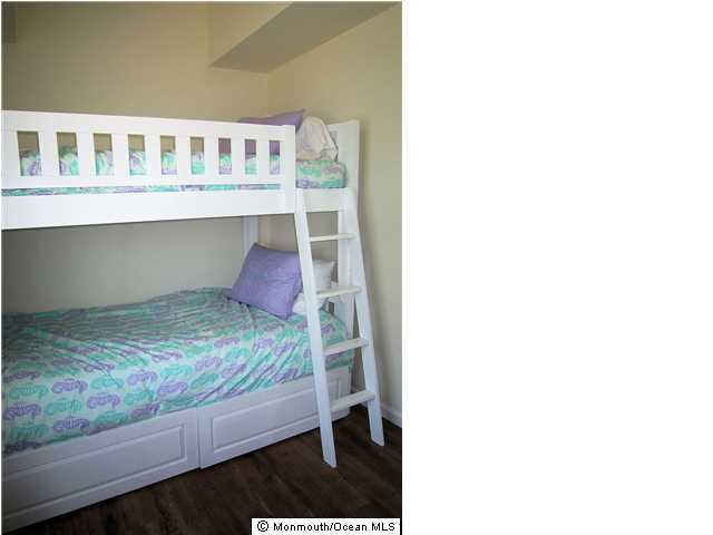 3305 Seaview Road Lavallette, NJ 08735 - Photo 9 of 13 a bedroom with a bed and a window
