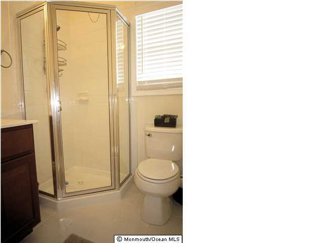 3305 Seaview Road Lavallette, NJ 08735 - Photo 10 of 13 a bathroom with a toilet and a shower