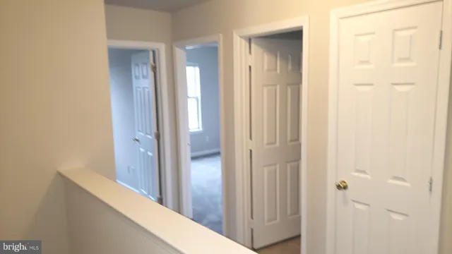 a view of a bathroom from a hallway