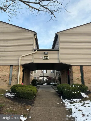 a view of a car park in front of house