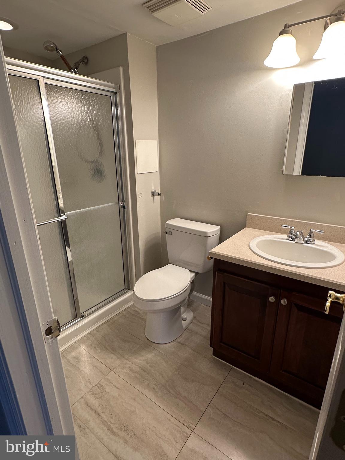 1801 Egg Harbor Road, Unit 105 Clementon, NJ 08021 - Photo 8 of 14 a bathroom with a sink and a mirror