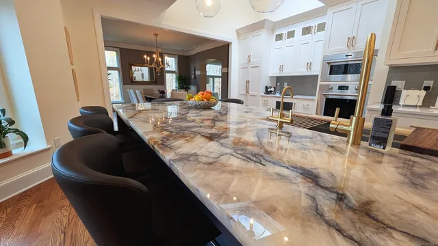 a living room with fireplace furniture and a large window