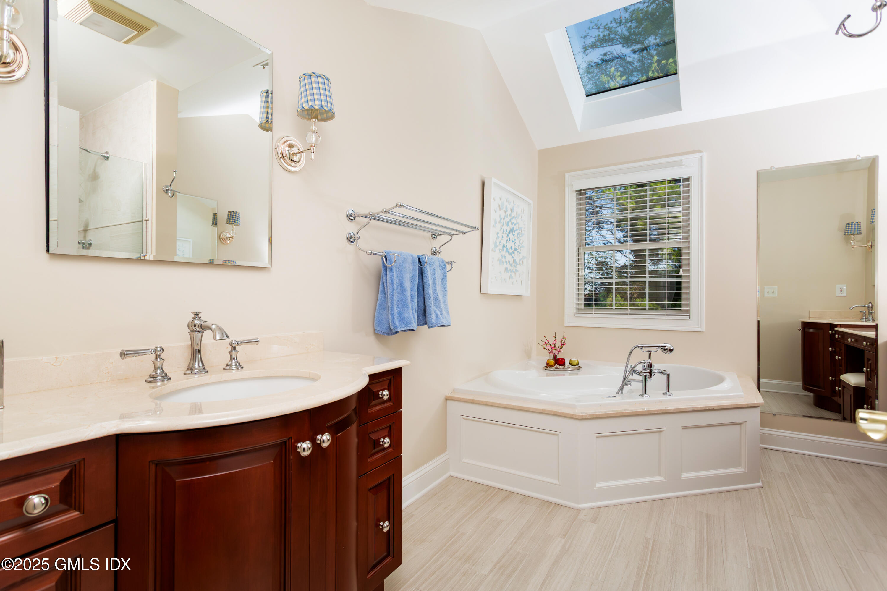 105 Hamilton Avenue, Unit 9 Greenwich, CT 06830 - Photo 11 of 20 a bathroom with a sink double vanity and a mirror