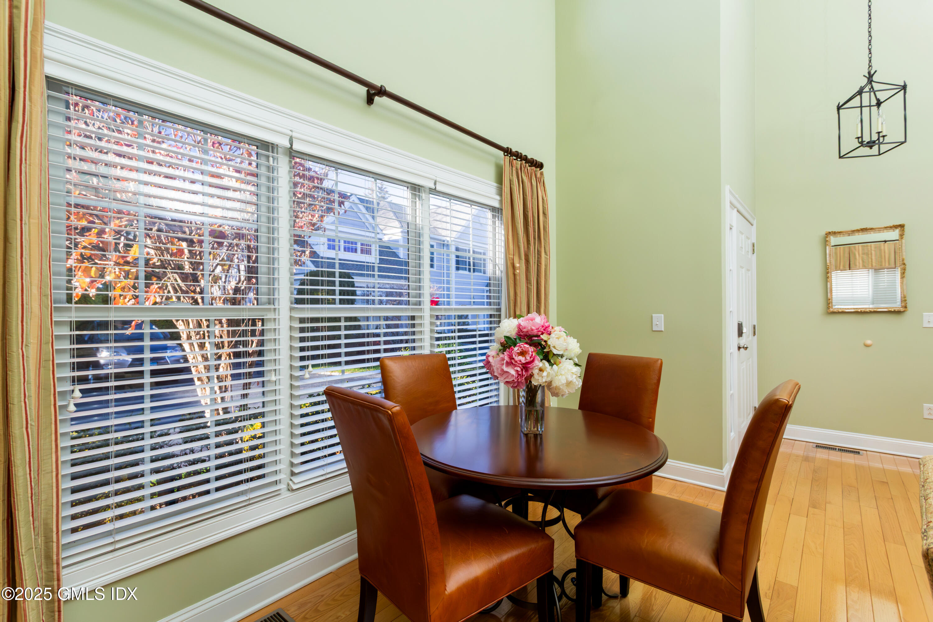 105 Hamilton Avenue, Unit 9 Greenwich, CT 06830 - Photo 4 of 20 a view of a dining room with furniture and window