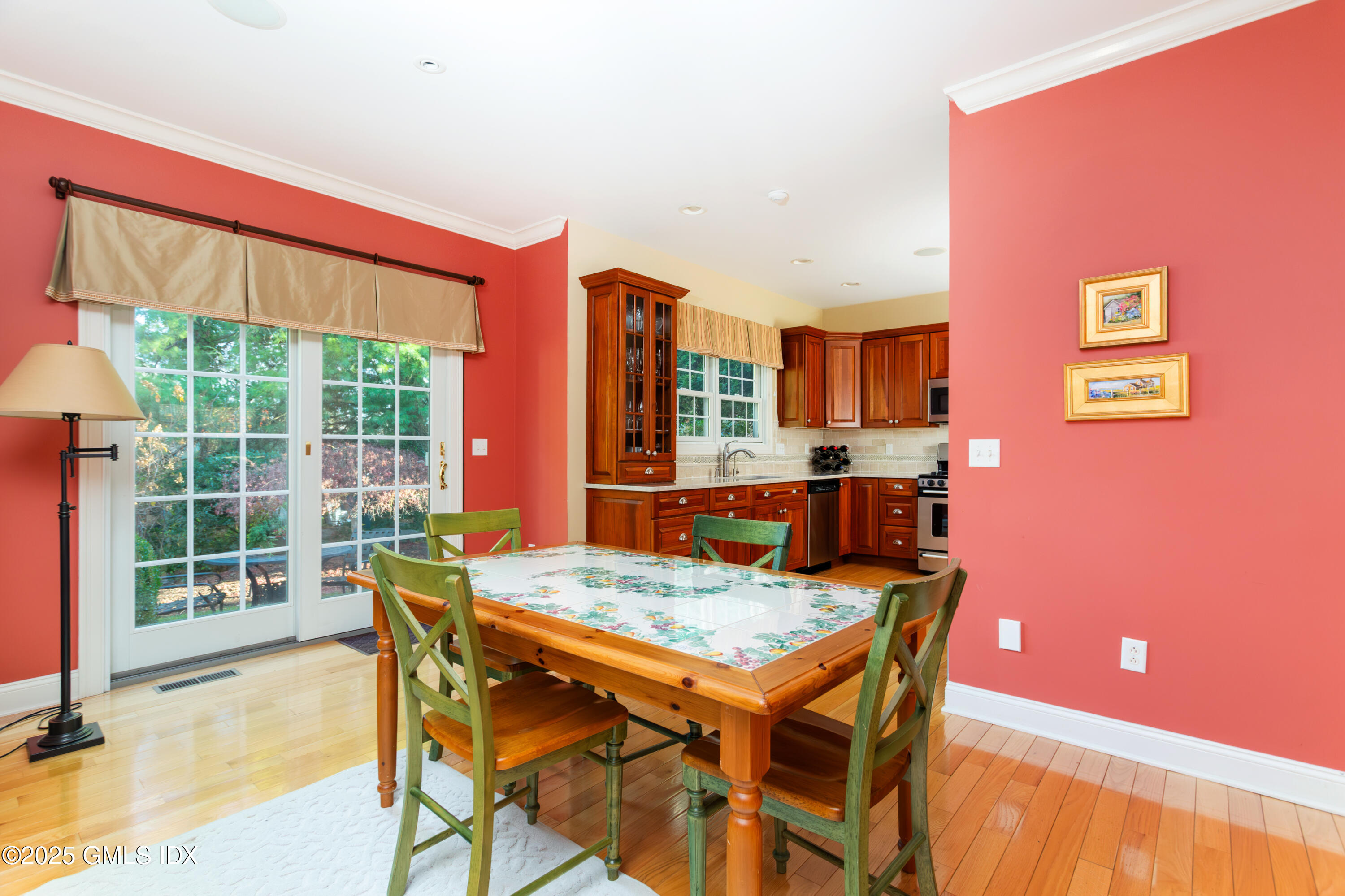 105 Hamilton Avenue, Unit 9 Greenwich, CT 06830 - Photo 5 of 20 a dining room with furniture and wooden floor