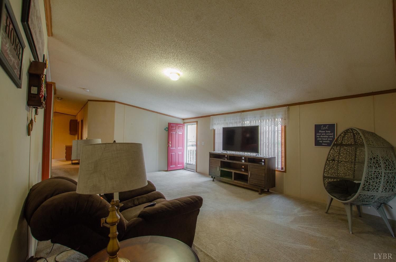 1708 Mud Street Concord, VA 24538 - Photo 12 of 44 a living room with furniture and a flat screen tv