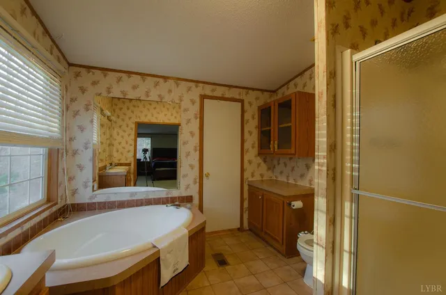 a bathroom with a tub and shower