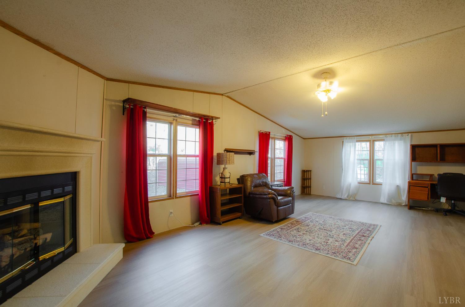 1708 Mud Street Concord, VA 24538 - Photo 20 of 44 a living room with furniture and a fireplace