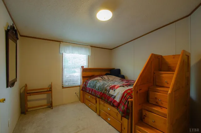 a view of an empty room and wooden shelves
