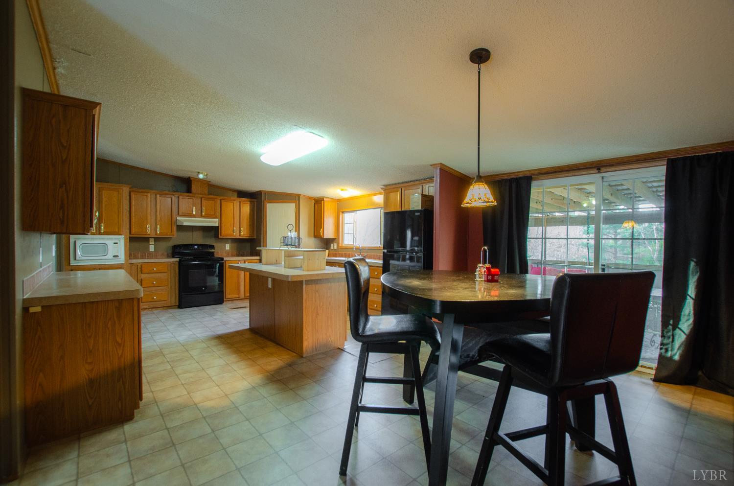 1708 Mud Street Concord, VA 24538 - Photo 6 of 44 a view of kitchen with cabinets table and chairs