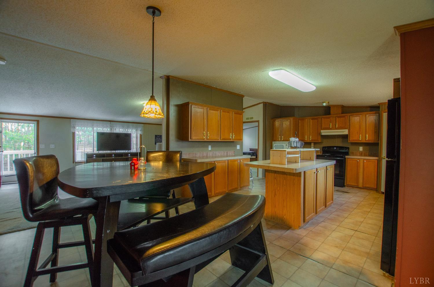 1708 Mud Street Concord, VA 24538 - Photo 7 of 44 a kitchen with a table chairs sink and cabinets