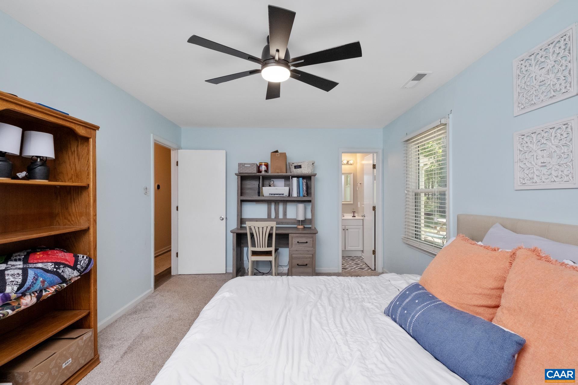 71 Azalea Road Ruckersville, VA 22968 - Photo 13 of 23 a bed room with a bed and a book shelf