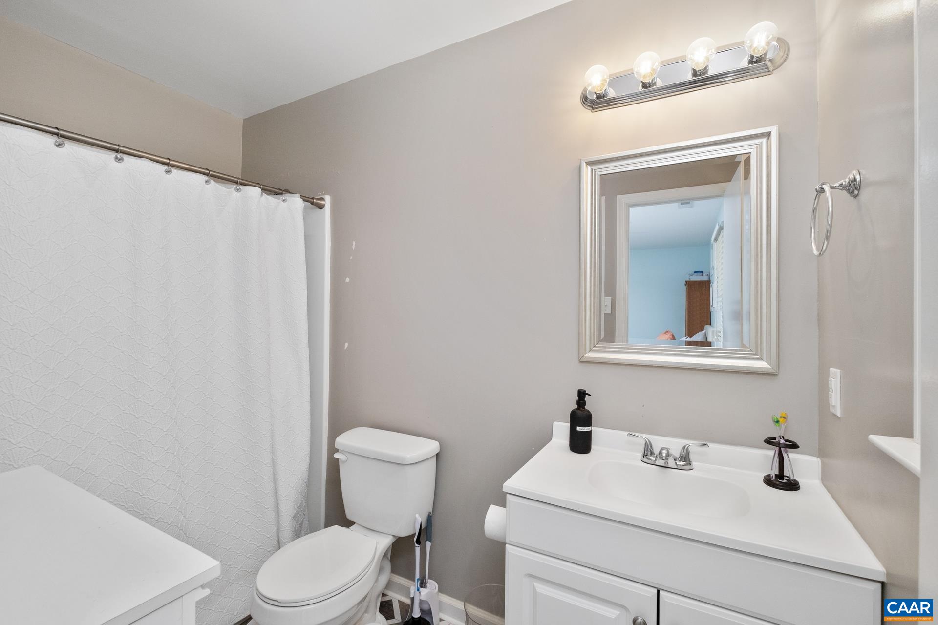 71 Azalea Road Ruckersville, VA 22968 - Photo 15 of 23 a bathroom with a sink mirror vanity and toilet