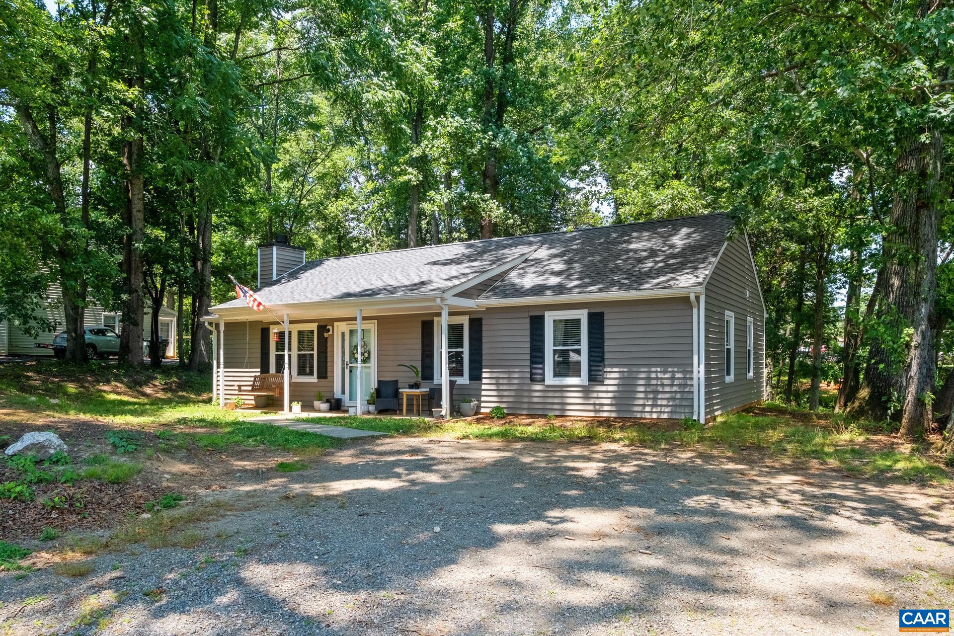 71 Azalea Road Ruckersville, VA 22968 - Photo 2 of 23 a front view of a house with a garden