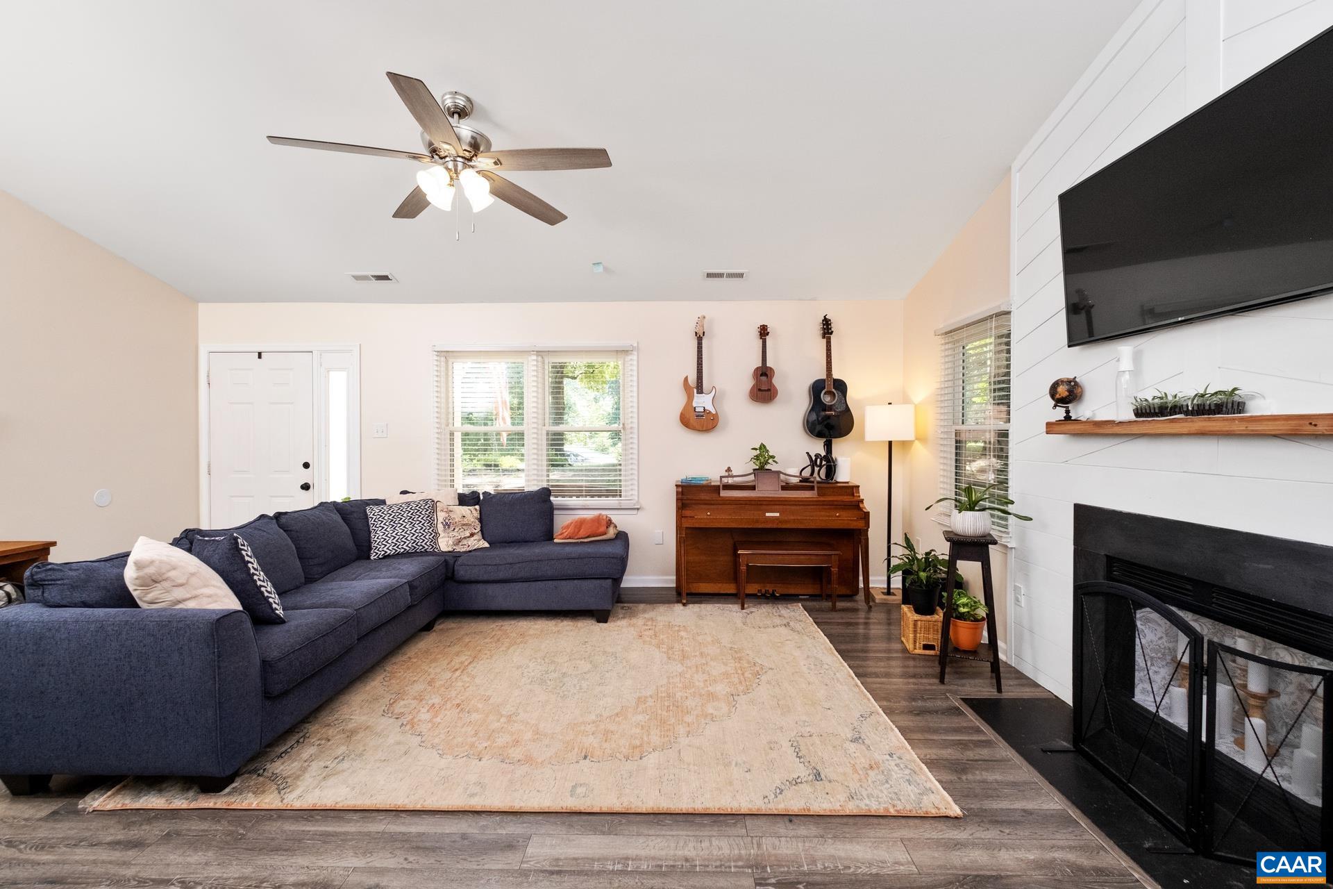 71 Azalea Road Ruckersville, VA 22968 - Photo 6 of 23 a living room with furniture and a flat screen tv