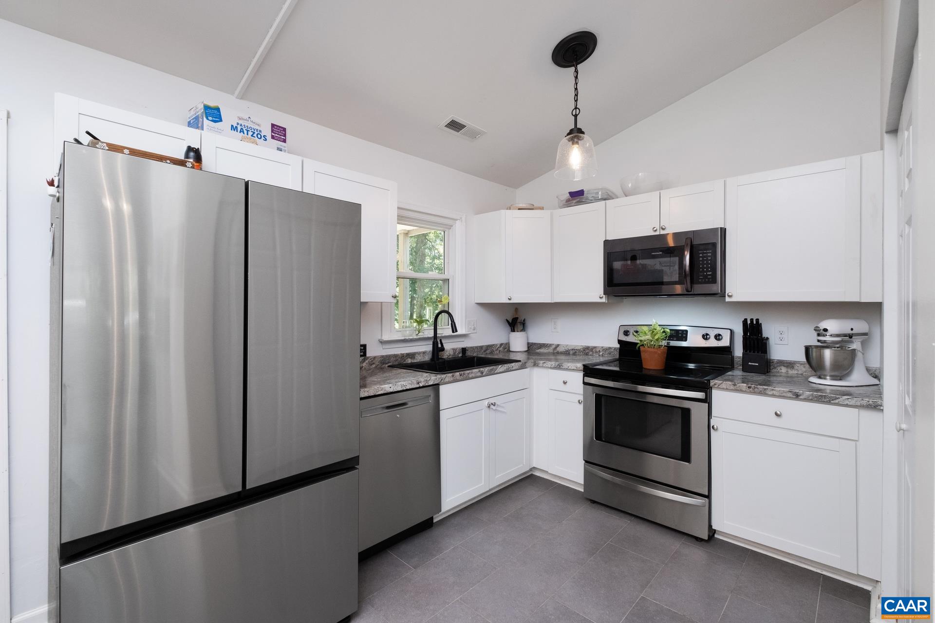 71 Azalea Road Ruckersville, VA 22968 - Photo 10 of 23 a kitchen with stainless steel appliances a refrigerator sink and microwave