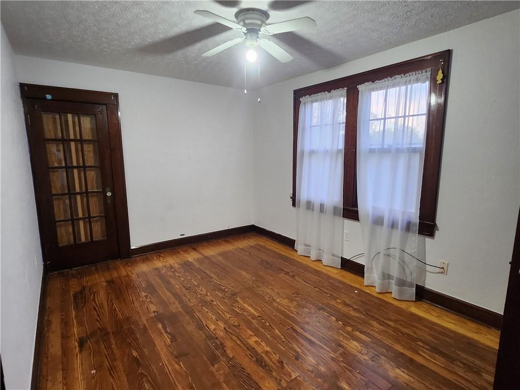 6 Hadley Road Greenville, PA 16125 - Photo 6 of 9 a view of an empty room with wooden floor and a window