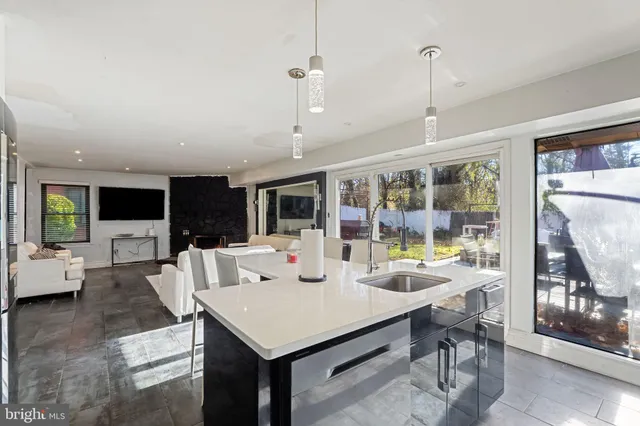 a view of an empty room and workspace with furniture