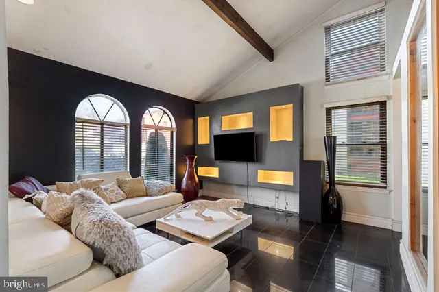 a living room with furniture and a large window