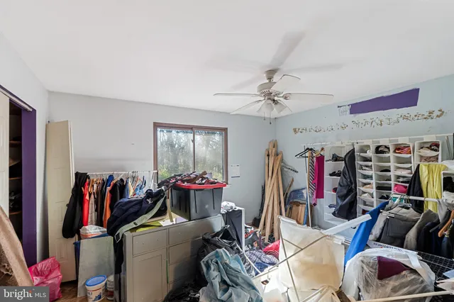 a living room with lots of stuff and a flat screen tv