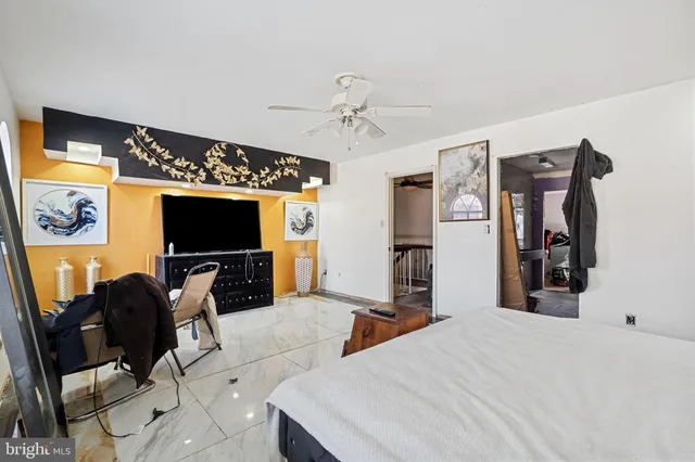 a view of a livingroom with furniture and a flat screen tv