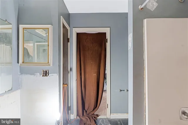 a view of a bathroom with a tub and mirror