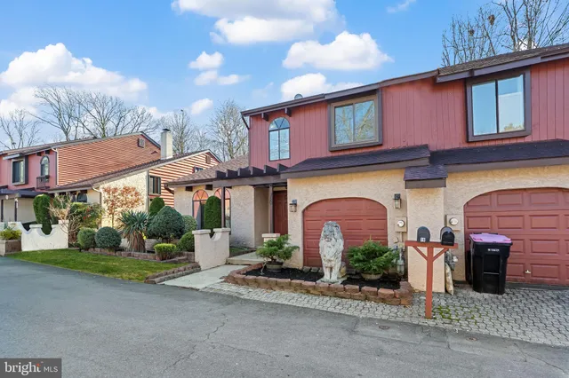 a front view of a building with garden