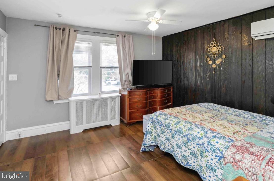 914 Township Line Road Elkins Park, PA 19027 - Photo 14 of 22 a bedroom with a bed and a flat screen tv