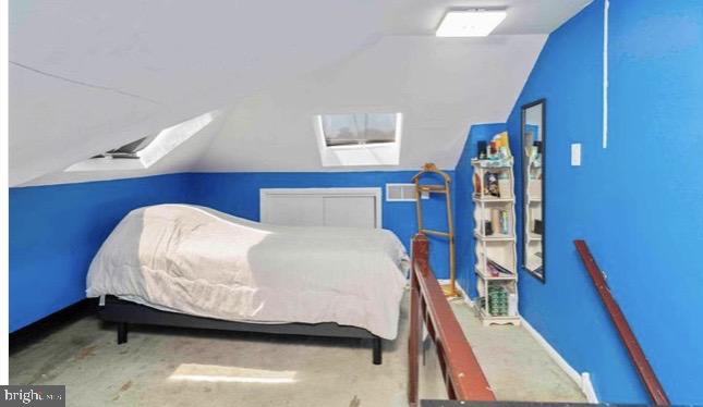 914 Township Line Road Elkins Park, PA 19027 - Photo 15 of 22 a bedroom with a bed and a mirror