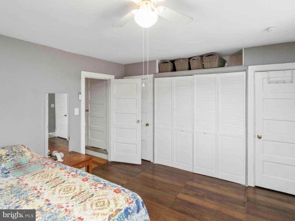 914 Township Line Road Elkins Park, PA 19027 - Photo 17 of 22 a bedroom with a bed and a chandelier