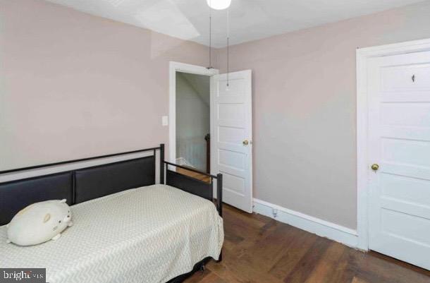 914 Township Line Road Elkins Park, PA 19027 - Photo 10 of 22 a bedroom with a bed and a wooden floor