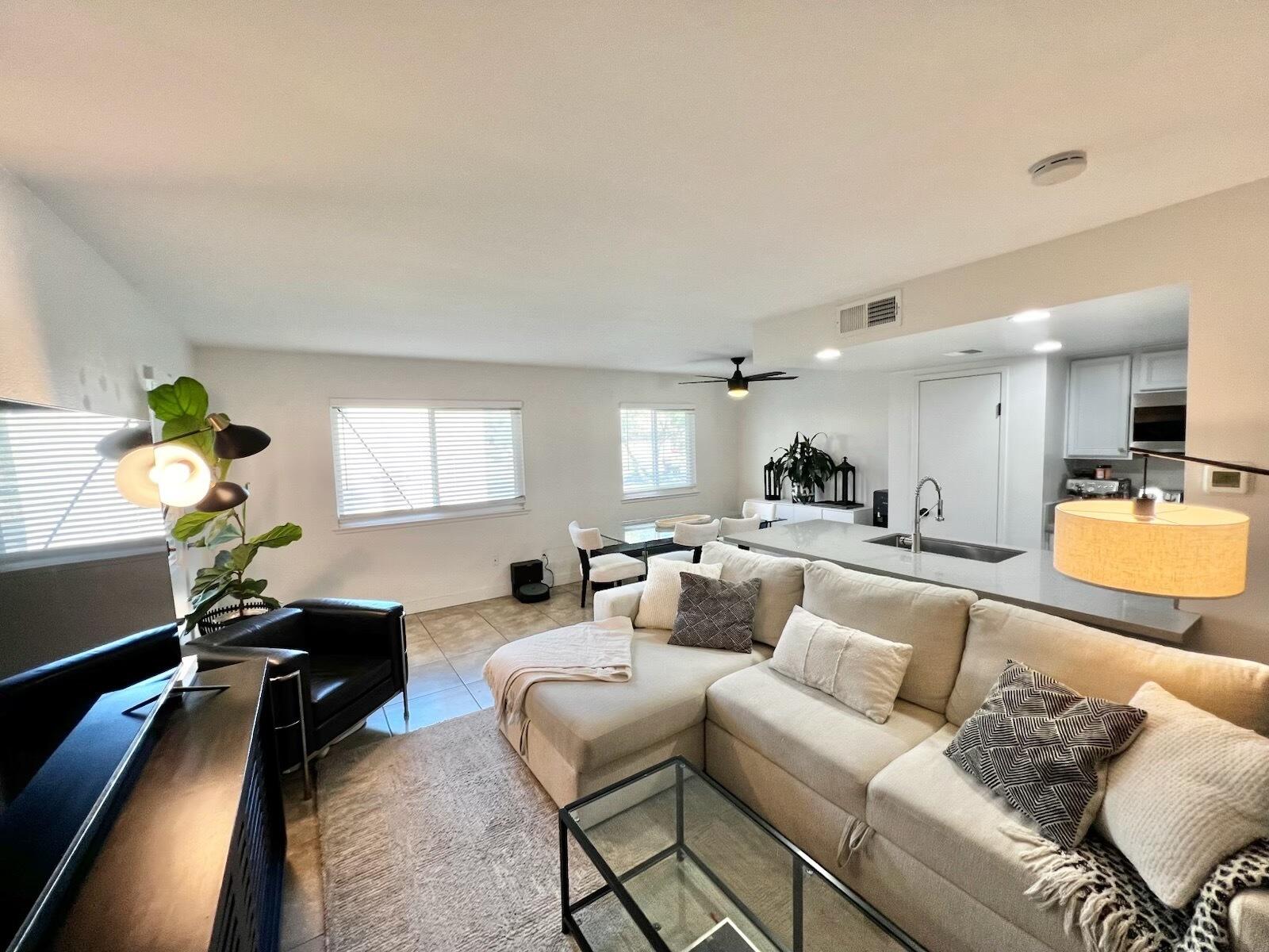 72671 Eagle Road, Unit 3 Palm Desert, CA 92260 - Photo 1 of 25 a living room with furniture and a wooden floor