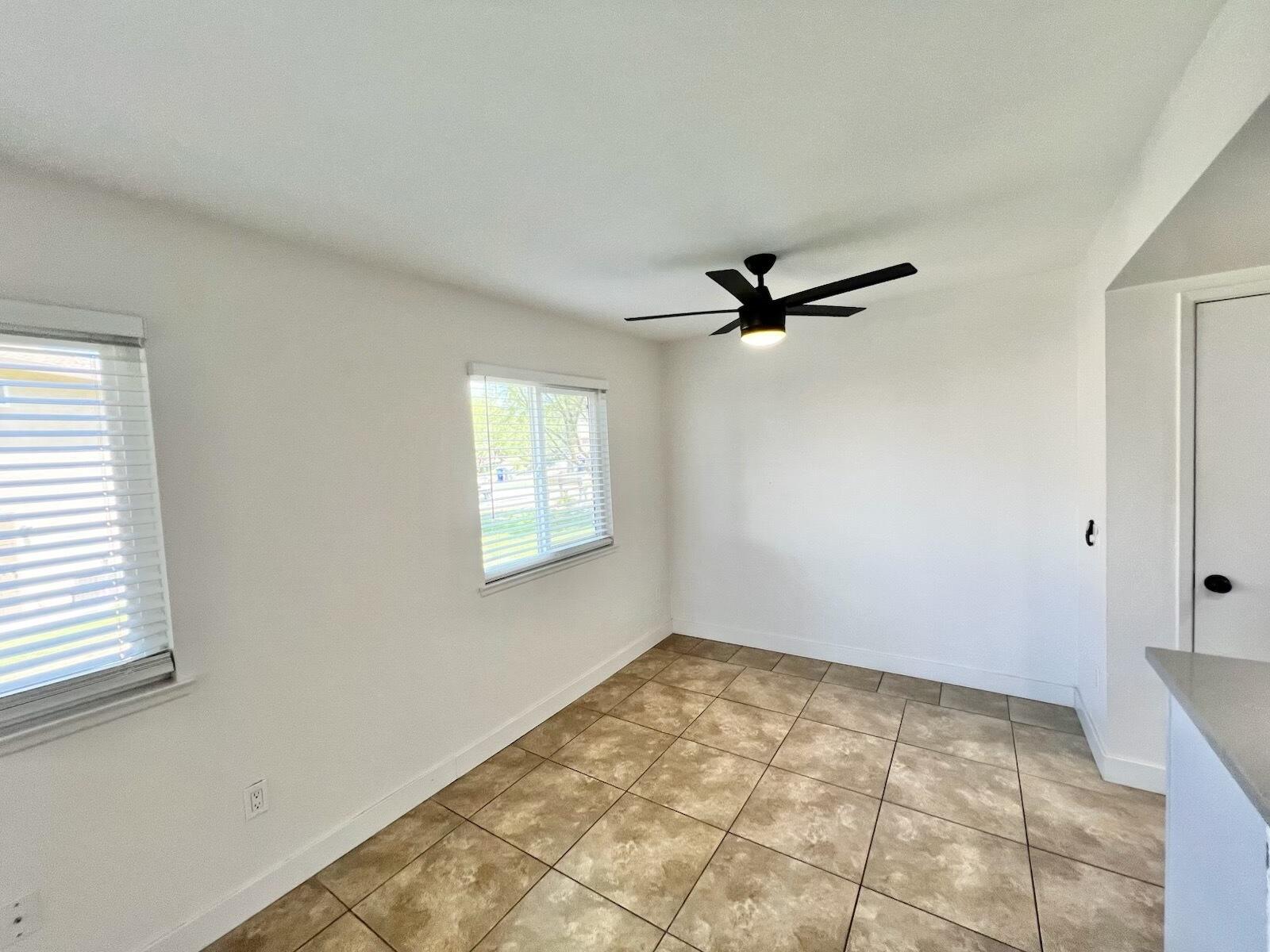 72671 Eagle Road, Unit 3 Palm Desert, CA 92260 - Photo 12 of 25 a view of a livingroom with a ceiling fan and window